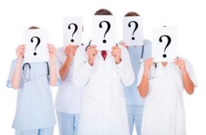Group Of Doctors With Question Mark Sign